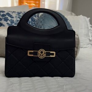 Valentino Orlandi, black clutch